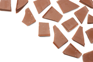 cracked chocolate candies sweets isolated on white background top view
