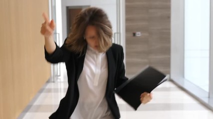 Business Woman Dancing In Office Hall Wearing Wireless Earphones