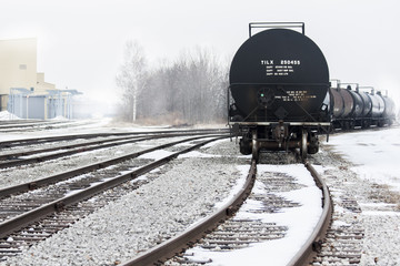 Tanker train cars on a foggy winter day