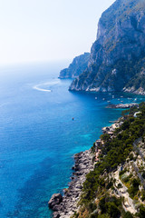 Fototapeta premium A beautiful rocky coast and the sea on a summer sunny day - a travel or natural background. Place under the text