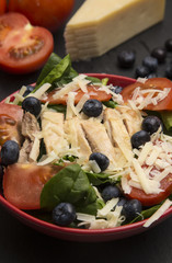 Fresh Salad with Chicken, Tomatoes Blueberries and Parmesean Cheese