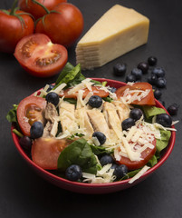 Fresh Salad with Chicken, Tomatoes Blueberries and Parmesean Cheese