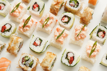 Japanese sushi rolls on white background