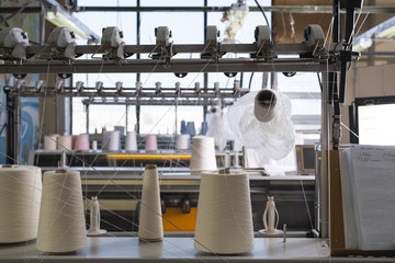 Fototapeta premium Spools with thread at rewinding machine