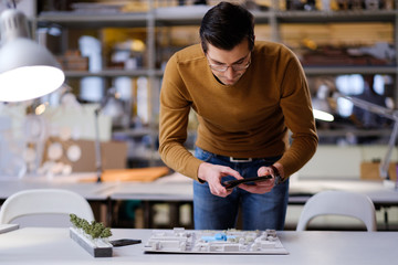 Man working in design and engineering architecture office.