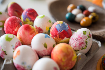 Fototapeta na wymiar Colored Easter eggs in the basket.Easter Eggs hand painted.Easter eggs in a wooden basket