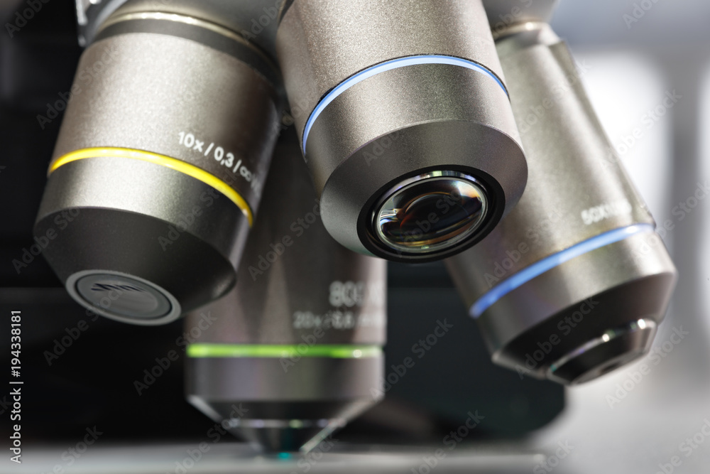 Aufkleber Close up of examining of test sample under the microscope in laboratory.