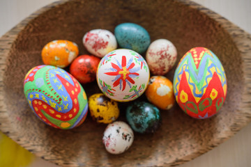 Colored Easter eggs in the basket.Easter Eggs hand painted.Easter eggs in a wooden basket