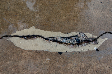 Failed Concrete Patch on Crack