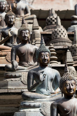 Buddha statues and small stupas in Gangaramaya temple, Colombo, Sri Lanka.