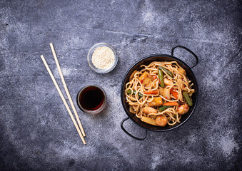 Stir fry noodles with chicken, tofu and vegetable.