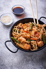 Stir fry noodles with chicken, tofu and vegetable.