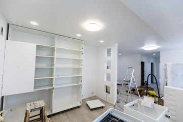 Custom kitchen cabinets in various stages of installation base for island in center