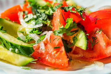 Fresh salad with tomatoe and cucumber close