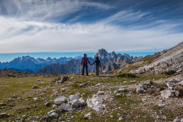 Fototapeta premium young couple in italien dolomites, loving nature and climbing, tre cime di lavaredo