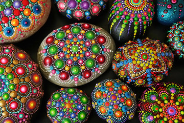 Beautiful rock mandalas painted with a brush