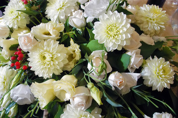 A bouquet of roses and white chrysanthemums