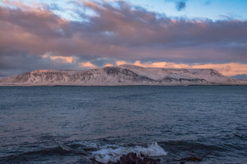 Winter sunset above Atlantic ocean, Iceland, Reykjavik.