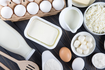 Dairy products on wooden table.