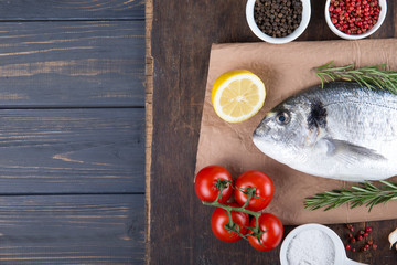 Raw fish dorado cooking and ingredients.