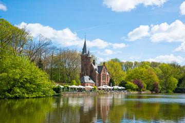 Minnewater castle at the Lake of Love in Bruges, Belgium.