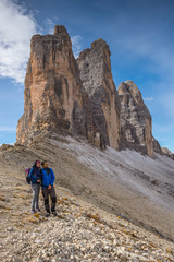 young couple in italien dolomites, loving nature and climbing, tre cime di lavaredo