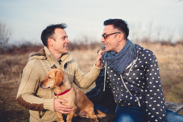 Gay parents with daughter and dog
