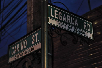 Street name signs-junction of Cariño with Legarda road. Baguio-Benguet province-Philippines. 0257