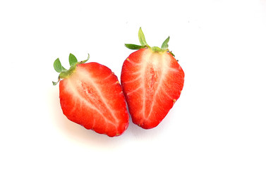 Two slice of half strawberry and leaves