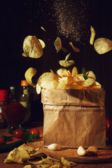 Flying chips on a dark background.