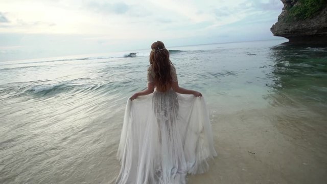 Bride on the beach in the sea