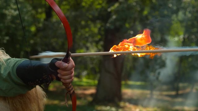 Flaming arrow release, slow motion