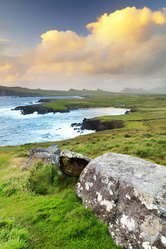 Europe, Ireland, sunset view over Ballyferriter Bay, Sybil Point and the peaks of the Three Sisters, Dingle Peninsula, County Kerry, Ireland