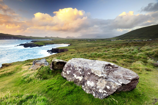 Europe, Ireland, sunset view over Ballyferriter Bay, Sybil Point and the peaks of the Three Sisters, Dingle Peninsula, County Kerry, Ireland