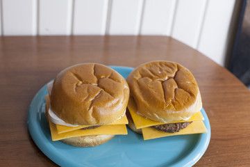 A pair of veggie cheeseburgers on sweet buns