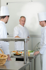 apprentice cooks in restaurant kitchen