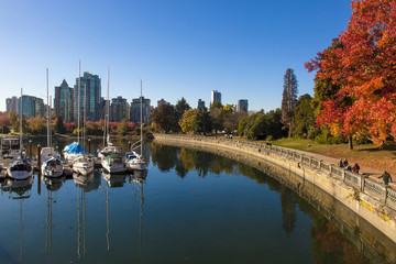 Walking along the seawall in Stanley Park, Vancouver on a sunny autumn day