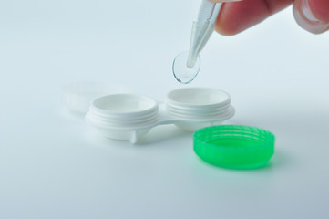 Contact lens and case.