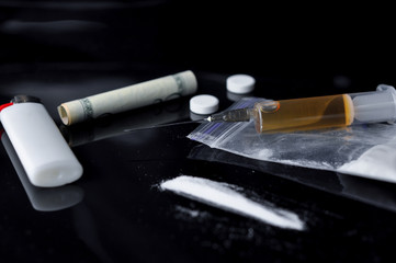 Hard drugs on black background.