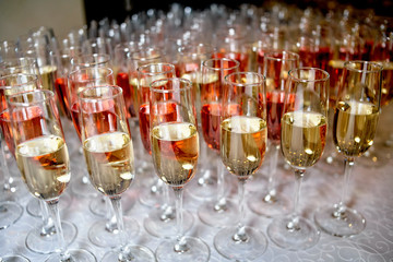 Lot of glasses with champagne and wine during on the party table