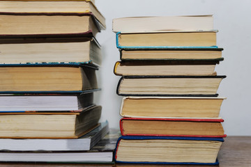 Stack of different books on a table