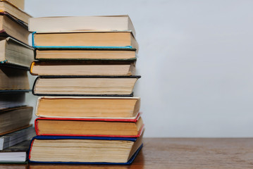 Stack of different books on a table