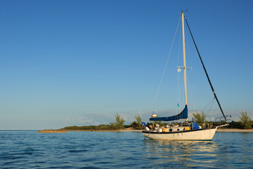 Fototapeta premium A gorgeous, traditional sailboat anchored out in the Bahamas.