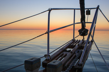A sunrise view off the bow of a sailboat cruising through the Exumas Island chain in the Bahamas.