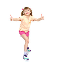 Little girl holding her thumb up