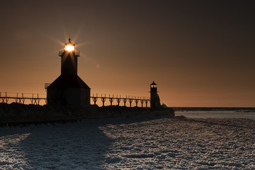 Lighthouse with warm sky and light beaming
