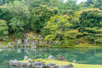 Fototapeta na wymiar Beautiful Sogenchi Garden at Tenryu-ji temple in Arashiyama, Kyoto. Lake reflections..Designated as a Special Place of Scenic Beauty and UNESCO World Heritage Site
