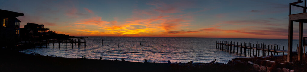 A panoramic shot of a sunset off of Ocracoke, NC in the Outer Banks.