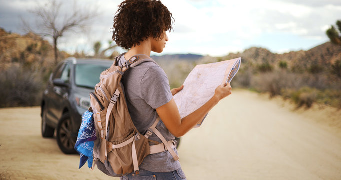 Young Traveler Woman Looking At Map In Joshua Tree National Park