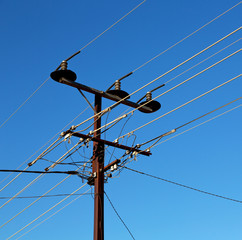power line with electrical pole in the clear sky
